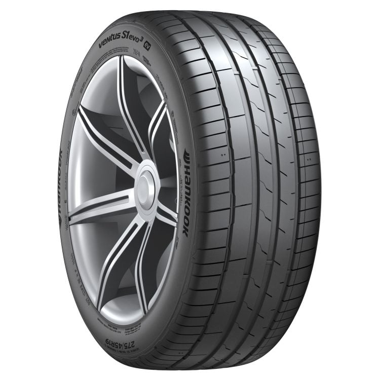 Car tire with rim on a white background
