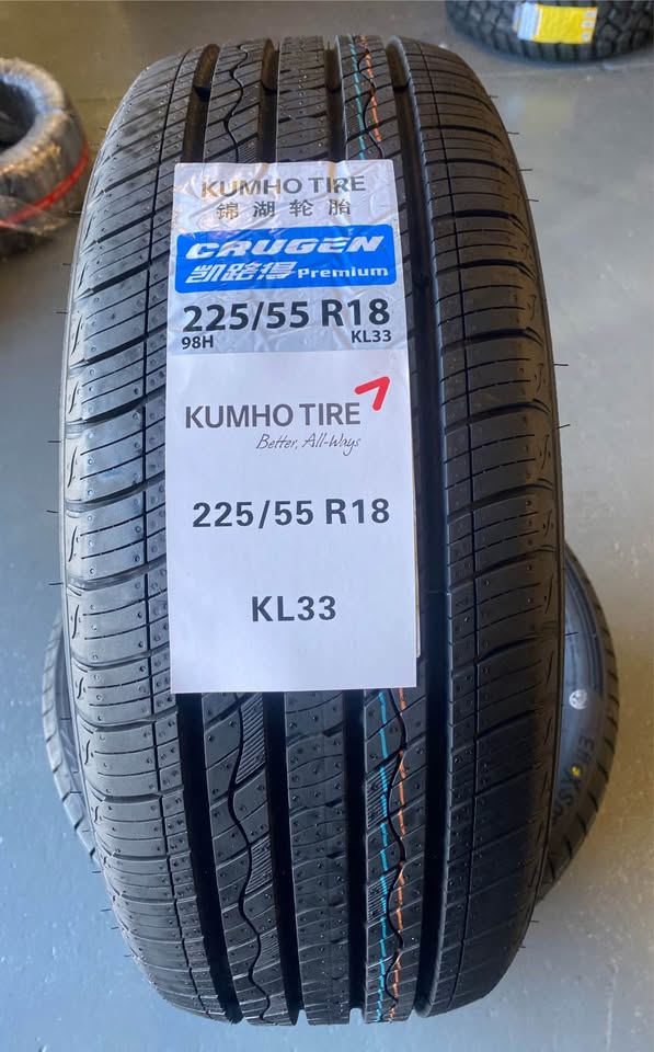 Kumho tire with specifications label on a gray surface