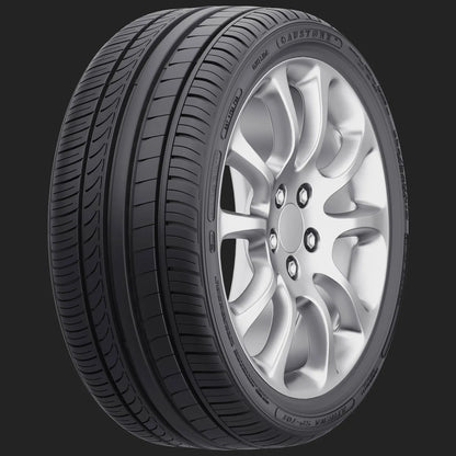 Car tire with silver alloy wheel on a black background