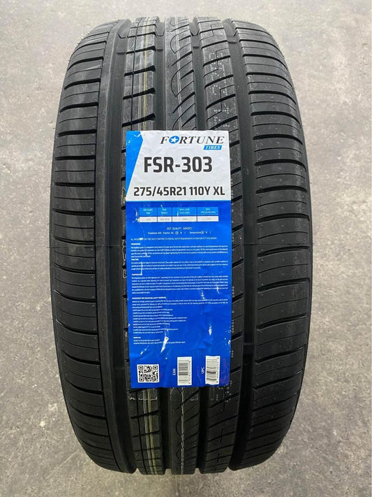 A black tire with a label indicating it is a Fortune FSR-303 tire, with the size 275/45R21 and additional details such as tread pattern and brand information.